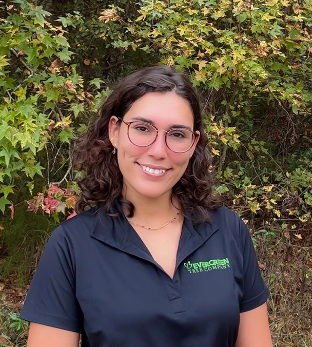 Loren Castillo, ISA Certified Arborist and lead sales arborist at Evergreen Tree Company, standing outdoors.